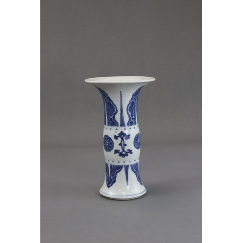 77 - A Blue and White Beaker Vase, Kangxi, the neck and lower body both painted with stylised plantain la... 