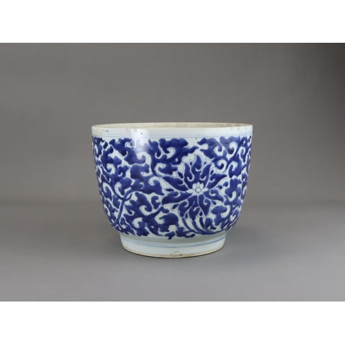 78 - A Blue and White Lotus Deep Bowl, Kangxi of rounded shape and tapering sides to straight foot, scrol... 