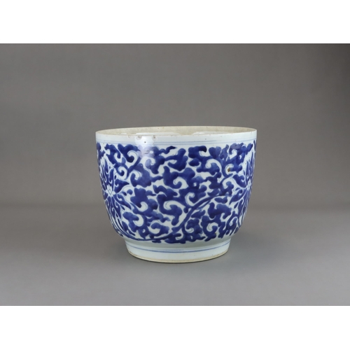 78 - A Blue and White Lotus Deep Bowl, Kangxi of rounded shape and tapering sides to straight foot, scrol... 