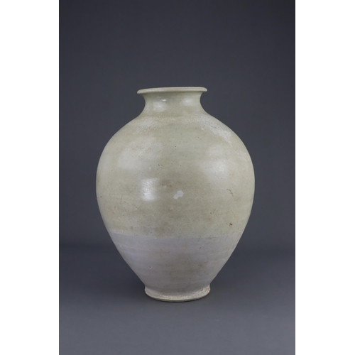 8 - A White-glazed Jar, Tang dynasty the finely potted oviform jar with short neck and rounded rim, cove... 