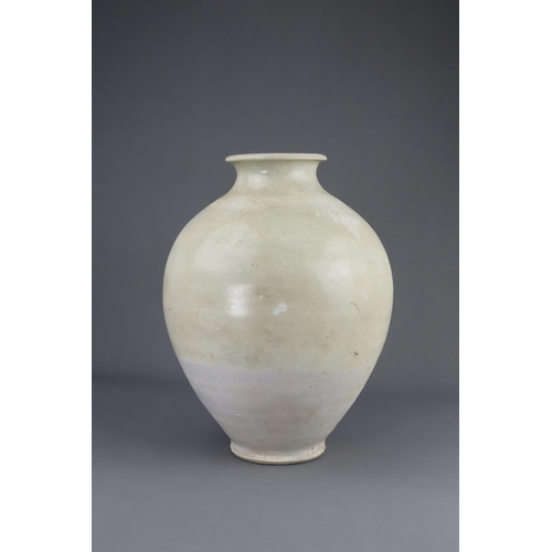 8 - A White-glazed Jar, Tang dynasty the finely potted oviform jar with short neck and rounded rim, cove... 