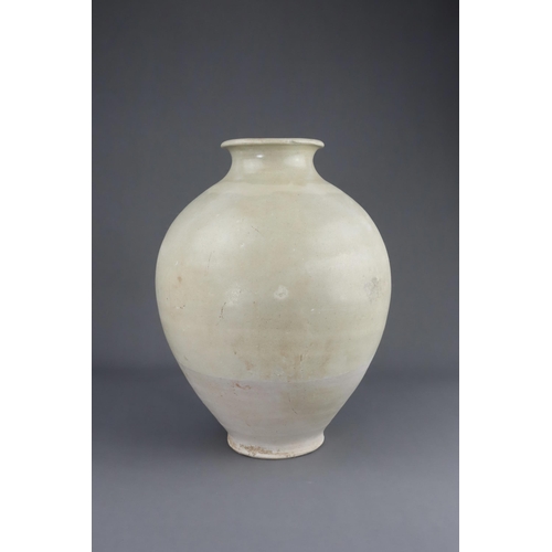 8 - A White-glazed Jar, Tang dynasty the finely potted oviform jar with short neck and rounded rim, cove... 