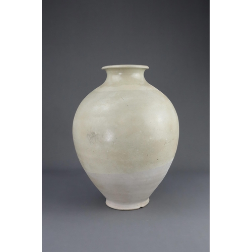 8 - A White-glazed Jar, Tang dynasty the finely potted oviform jar with short neck and rounded rim, cove... 