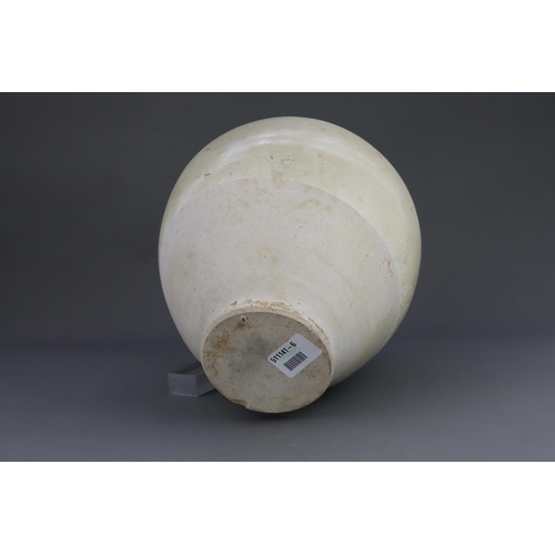 8 - A White-glazed Jar, Tang dynasty the finely potted oviform jar with short neck and rounded rim, cove... 