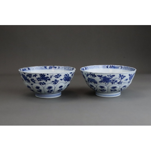 81 - A Pair of Moulded Blue and White Bowls, Kangxi, the exterior with a line of moulded lotus petals ris... 