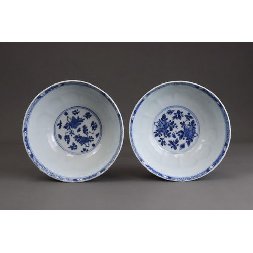 81 - A Pair of Moulded Blue and White Bowls, Kangxi, the exterior with a line of moulded lotus petals ris... 