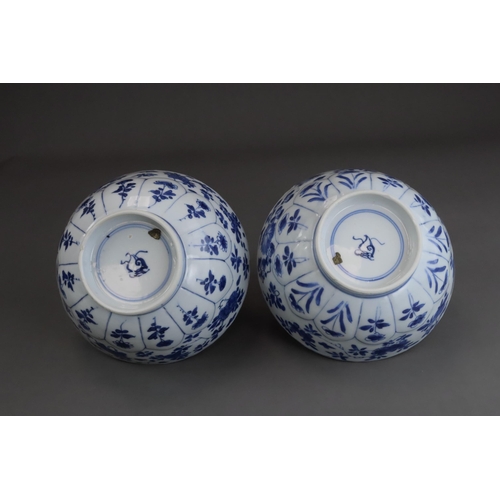 81 - A Pair of Moulded Blue and White Bowls, Kangxi, the exterior with a line of moulded lotus petals ris... 