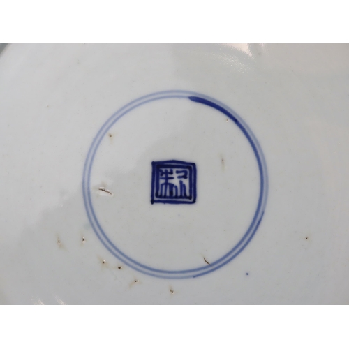 82 - A Blue and White 'Peony and Phoenix' Dish, Kangxi of rounded shape from the short tapering foot to t... 