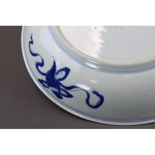 82 - A Blue and White 'Peony and Phoenix' Dish, Kangxi of rounded shape from the short tapering foot to t... 