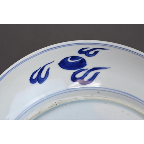 82 - A Blue and White 'Peony and Phoenix' Dish, Kangxi of rounded shape from the short tapering foot to t... 