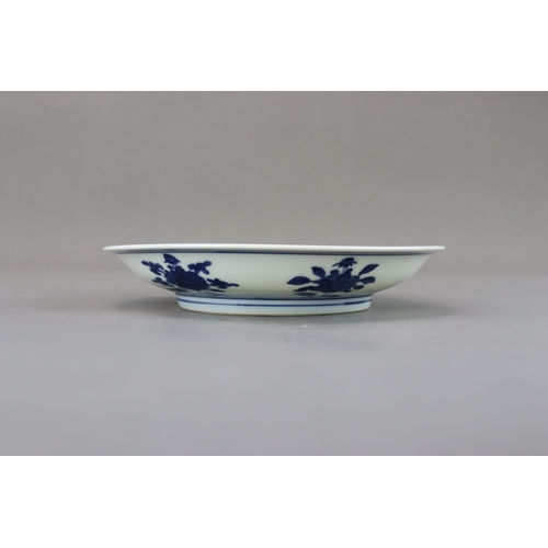 88 - A Blue and White Floral Dish, mark of Wanli but Kangxi period well painted in bright cobalt blue wit... 