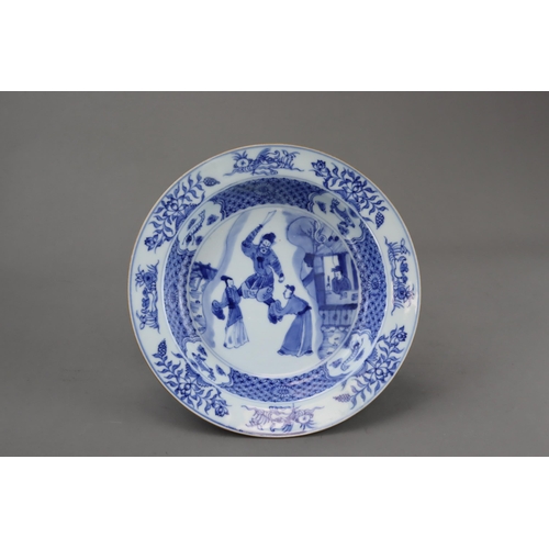 90 - A Blue and White Figural Plate, Kangxi of circular shape with everted rim, well painted in  the cent... 