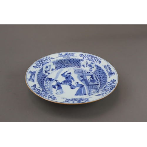 90 - A Blue and White Figural Plate, Kangxi of circular shape with everted rim, well painted in  the cent... 