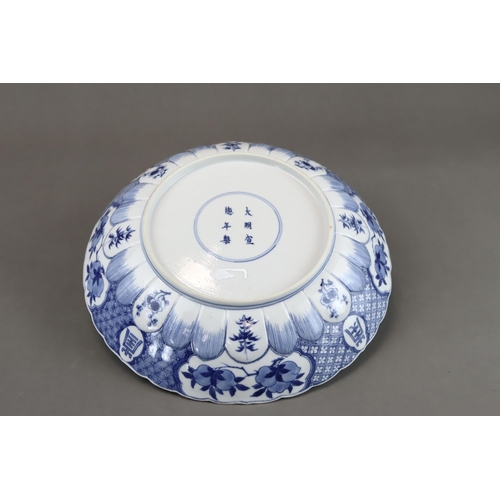 91 - A Blue and White 'Red Cliff' Dish, Kangxi, well painted in good blue with a central scene of boating... 