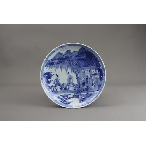 92 - A Blue and White Saucer Dish with Figures, Kangxi, well painted in good blue with a large central me... 