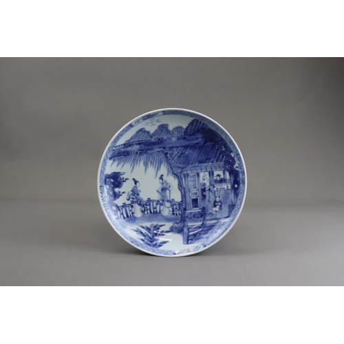 92 - A Blue and White Saucer Dish with Figures, Kangxi, well painted in good blue with a large central me... 