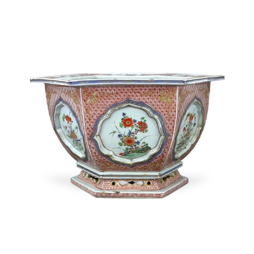 313 - A 'famille verte' Hexagonal Jardiniere, Kangxi, the rounded sides flaring from the waisted pierced f... 