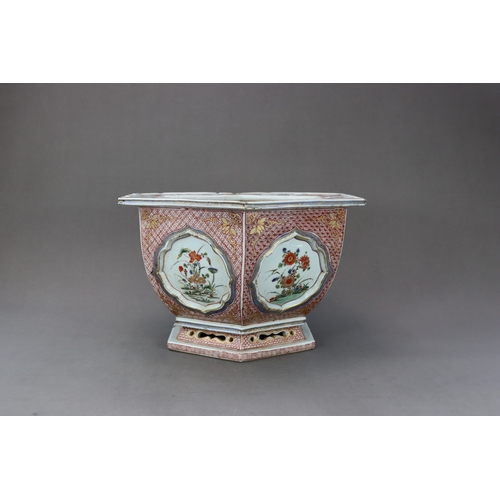 313 - A 'famille verte' Hexagonal Jardiniere, Kangxi, the rounded sides flaring from the waisted pierced f... 