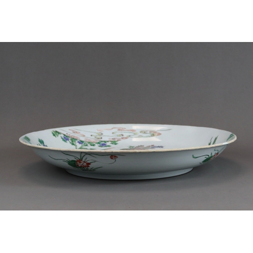 314 - A 'famille verte' Kylin and Phoenix Dish, Kangxi, brightly enamelled with an overall scene of the au... 