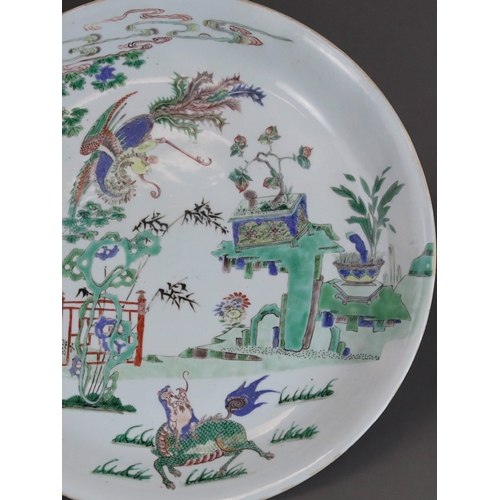 314 - A 'famille verte' Kylin and Phoenix Dish, Kangxi, brightly enamelled with an overall scene of the au... 