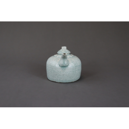 33 - A Qingbai Ewer and Cover, Song dynasty the beehive-shaped body rising from a flat unglazed base, mou... 