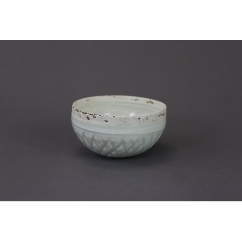 35 - A Qingbai Lotus Bowl, Song dynasty  the circular flat base rising to a straight rim, and carved on t... 