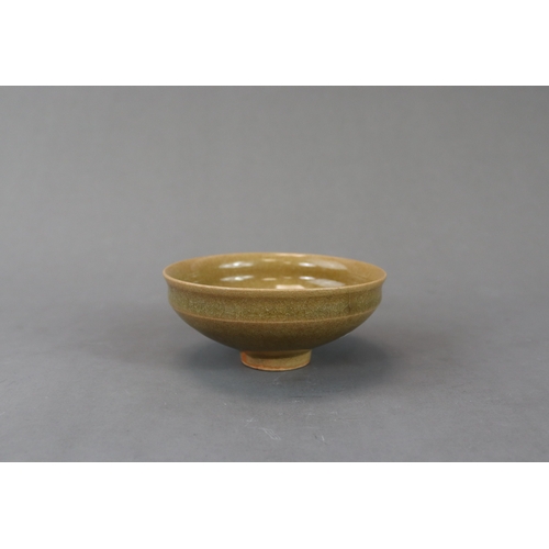 42 - A Longquan Yellow-glazed Cup, Song dynasty potted with rounded sides rising from a narrow foot to a ... 