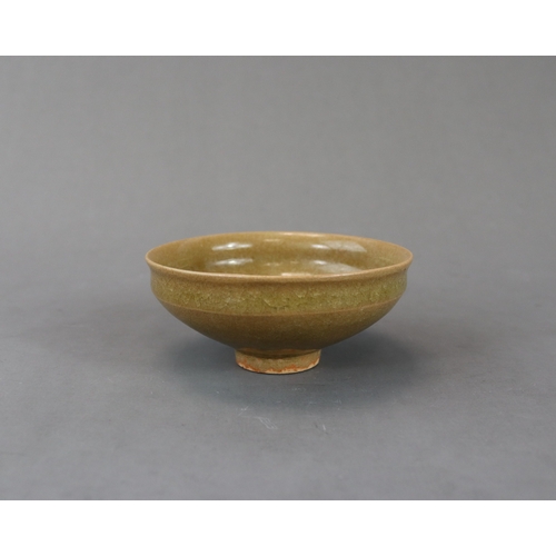 42 - A Longquan Yellow-glazed Cup, Song dynasty potted with rounded sides rising from a narrow foot to a ... 