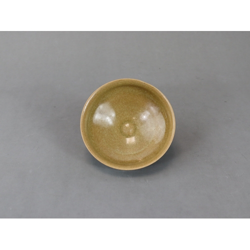 42 - A Longquan Yellow-glazed Cup, Song dynasty potted with rounded sides rising from a narrow foot to a ... 