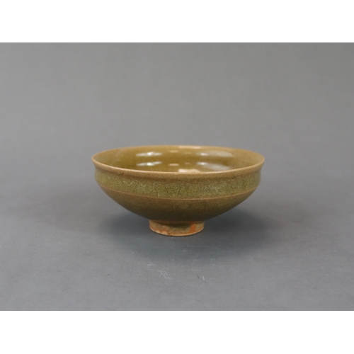 42 - A Longquan Yellow-glazed Cup, Song dynasty potted with rounded sides rising from a narrow foot to a ... 