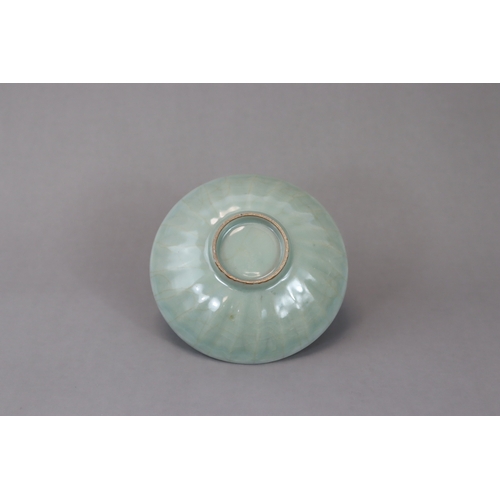 43 - A Longquan Celadon Lotus Dish, Song dynasty with a glossy translucent crackled glaze applied overall... 