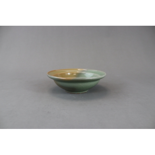 230 - A Longquan Celadon Dish, Song dynasty the rounded sides rising from a short straight foot to an ever... 