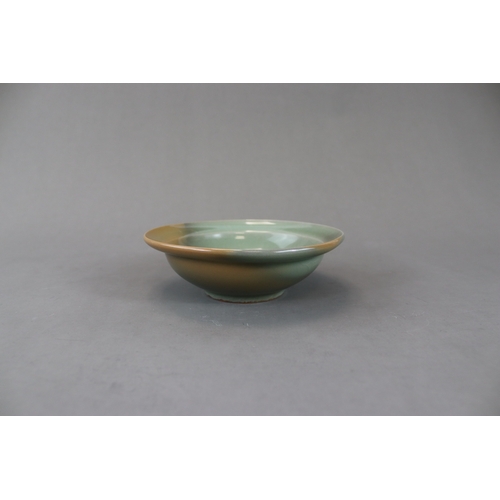 230 - A Longquan Celadon Dish, Song dynasty the rounded sides rising from a short straight foot to an ever... 