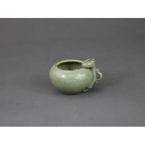 48 - A Rare Longquan Celadon Waterpot, Yuan dynasty finely potted with a figure climbing at the edge of t... 