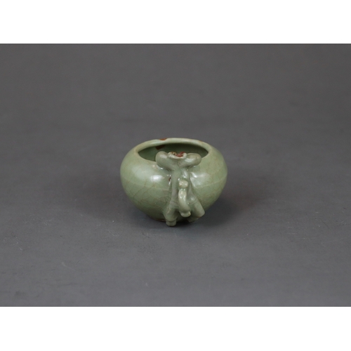 48 - A Rare Longquan Celadon Waterpot, Yuan dynasty finely potted with a figure climbing at the edge of t... 