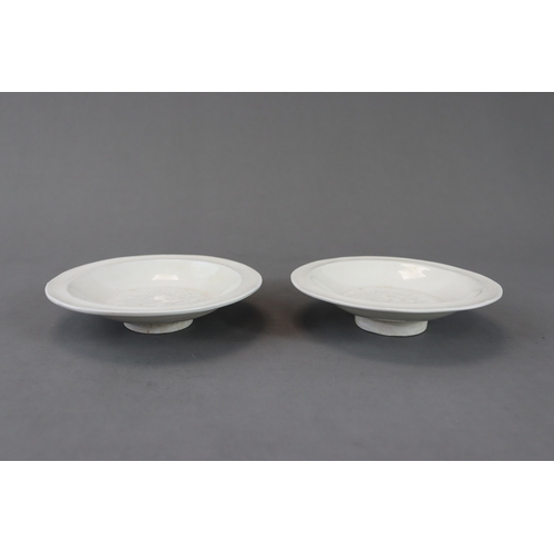 49 - A Pair of Huozhou White-glazed Moulded Dishes, Jin dynasty with rounded sides from straight foot to ... 