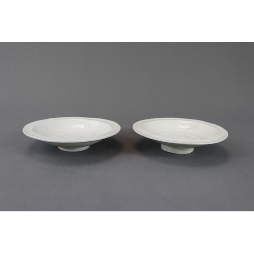 49 - A Pair of Huozhou White-glazed Moulded Dishes, Jin dynasty with rounded sides from straight foot to ... 