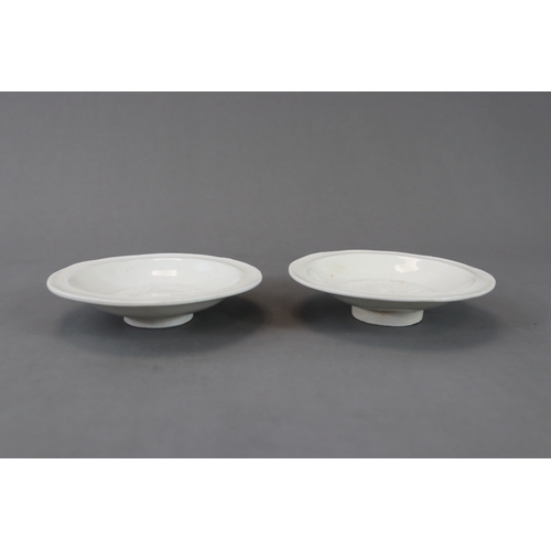 49 - A Pair of Huozhou White-glazed Moulded Dishes, Jin dynasty with rounded sides from straight foot to ... 