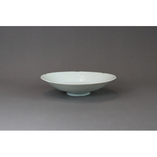 50 - A Qingbai Lobed Phoenixes Dish, Song dynasty  the wide everted rim divided into six lobes, freely ca... 