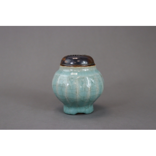 52 - A Longquan Celadon Lotus Jar, Song/Yuan dynasty the globular body rising from the splayed foot to th... 