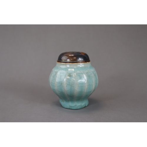 52 - A Longquan Celadon Lotus Jar, Song/Yuan dynasty the globular body rising from the splayed foot to th... 