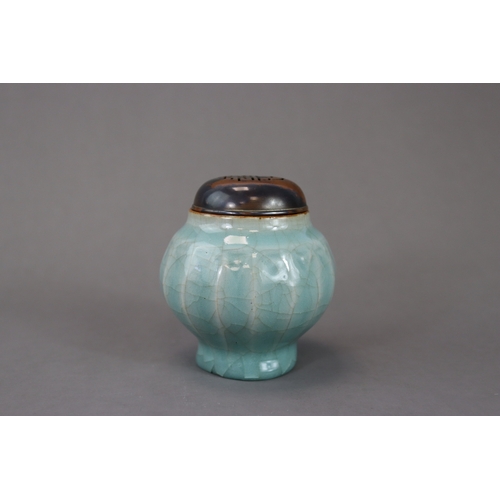 52 - A Longquan Celadon Lotus Jar, Song/Yuan dynasty the globular body rising from the splayed foot to th... 