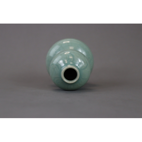 53 - A Longquan Celadon Double-gourd Vase, Song/Yuan dynasty the compressed globular lower bulb rising fr... 