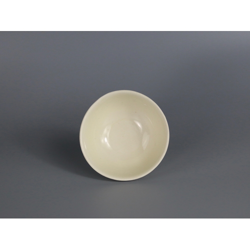 56 - A Ding white-glazed Bowl, Song dynasty with the deep rounded sides rising from a short foot, covered... 