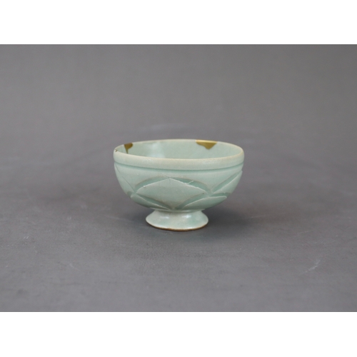 58 - A Rare Yaozhou Celadon Carved Stemcup, Five dynastic rising from a high spreading foot to deep round... 