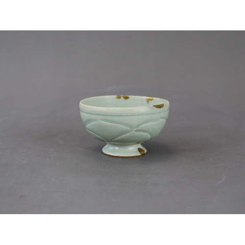 58 - A Rare Yaozhou Celadon Carved Stemcup, Five dynastic rising from a high spreading foot to deep round... 