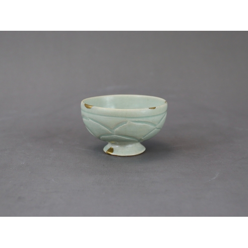 58 - A Rare Yaozhou Celadon Carved Stemcup, Five dynastic rising from a high spreading foot to deep round... 