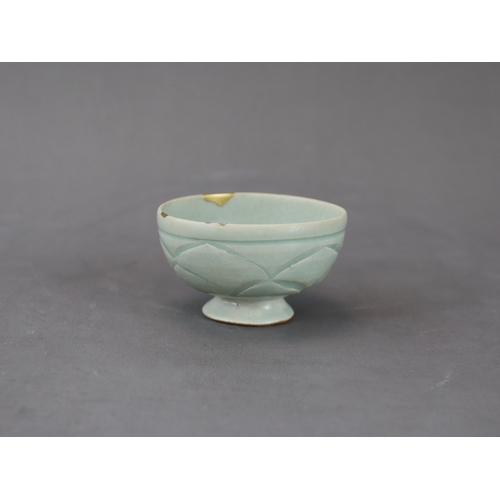 58 - A Rare Yaozhou Celadon Carved Stemcup, Five dynastic rising from a high spreading foot to deep round... 