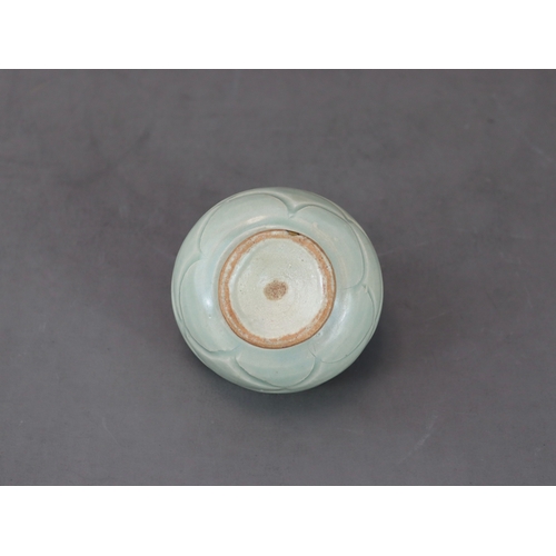 58 - A Rare Yaozhou Celadon Carved Stemcup, Five dynastic rising from a high spreading foot to deep round... 