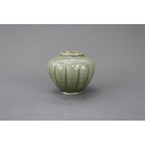 59 - A Rare Yaozhou Celadon Melon-shaped Jar, Song dynasty the lobed globular body thinly potted, rising ... 